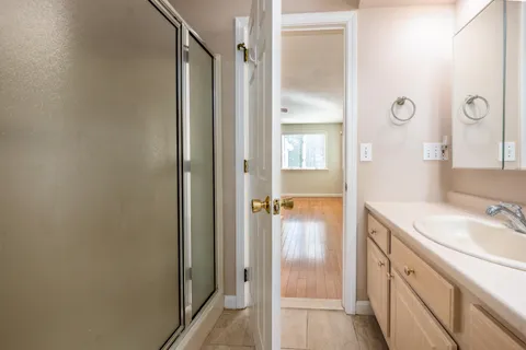 a bathroom with a sink and a mirror