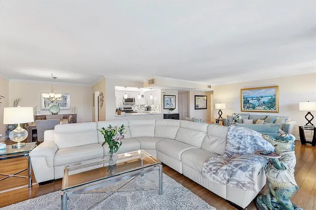 a kitchen with kitchen island a sink stainless steel appliances and cabinets