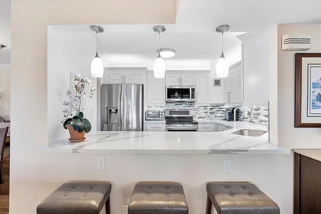 a kitchen with a sink stove and microwave