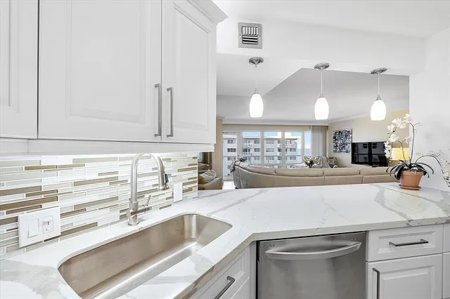 a large kitchen with a table and chairs