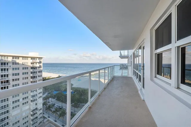 a view of a swimming pool with a lounge chairs