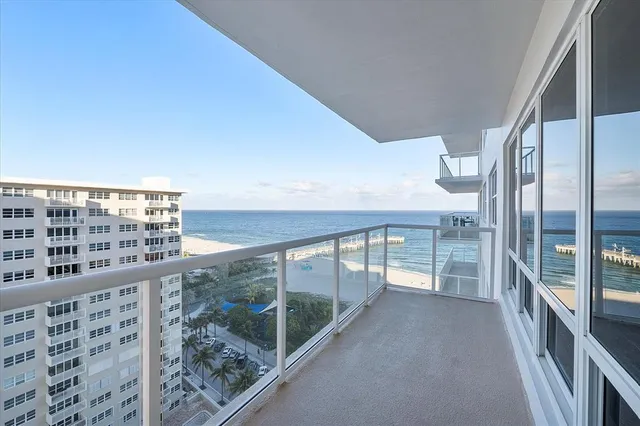 a view of swimming pool with outdoor seating and plants