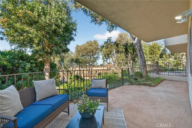 a view of a chair and table in the garden