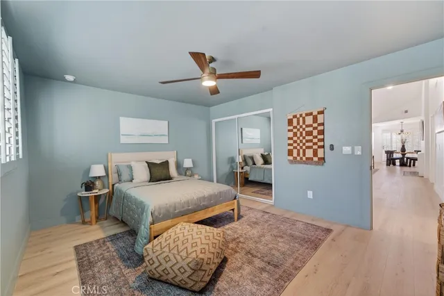 a bedroom with a bed and a dresser