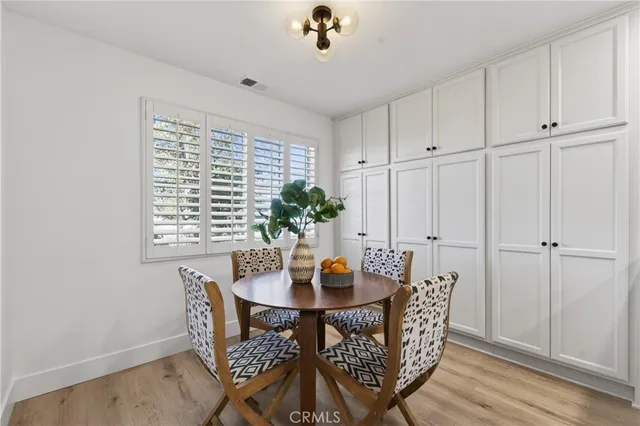 a view of a dining room with furniture and window