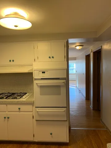 a kitchen with appliances and cabinets