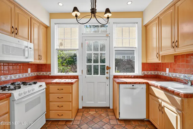 a bathroom with a shower and a glass door
