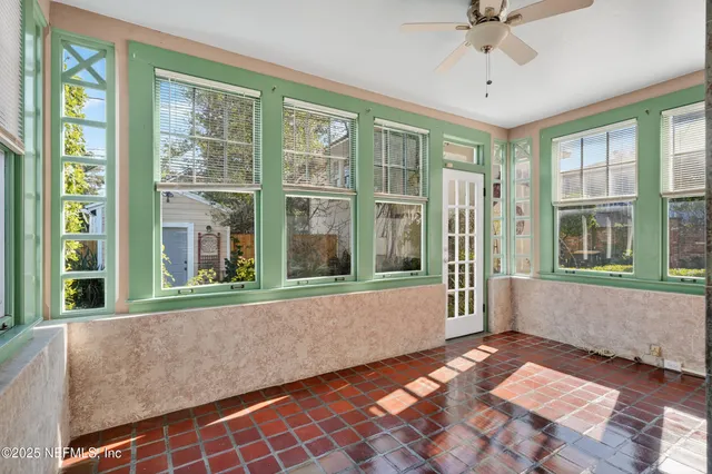 a kitchen with stainless steel appliances granite countertop a stove and a window