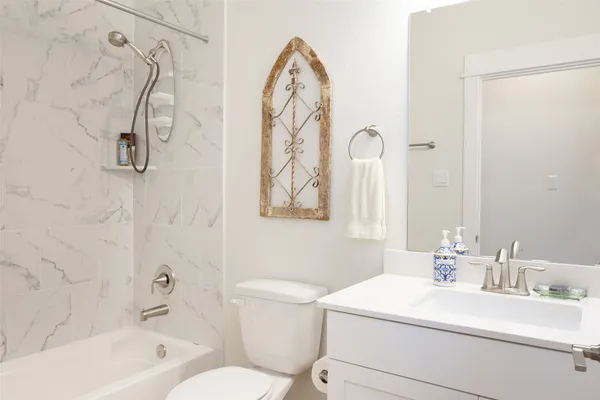 a bathroom with a sink a toilet and a bathtub