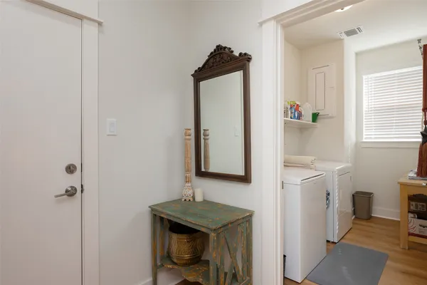 a view of a hallway with washer and dryer