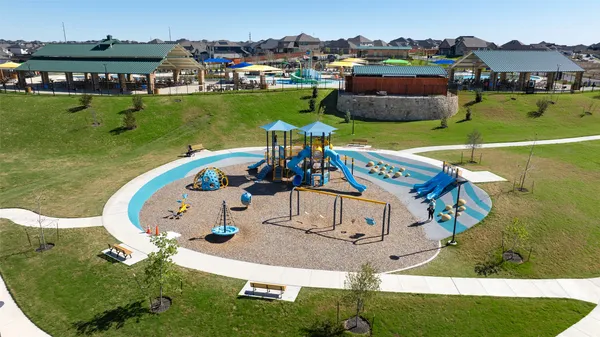 a view of a swimming pool with a yard