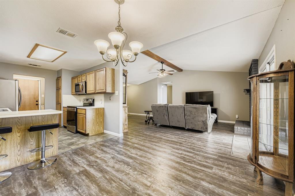 424 Benjamin Lane Arlington, TX 76002 - Photo 19 of 19 Kitchen featuring open floor plan and stainless steel appliances