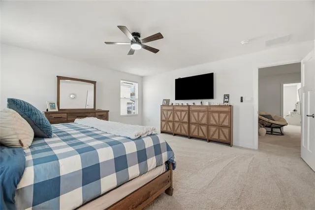 a bedroom with a bed and couch