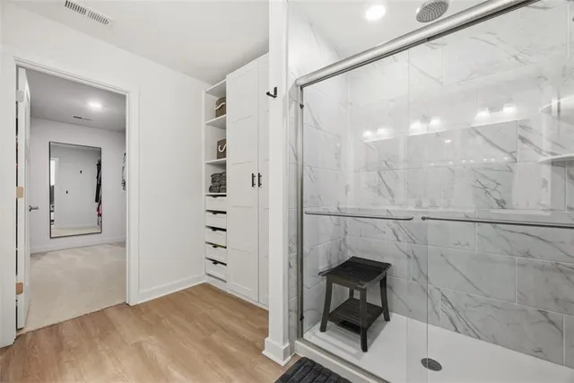 a bathroom with a sink and a shower