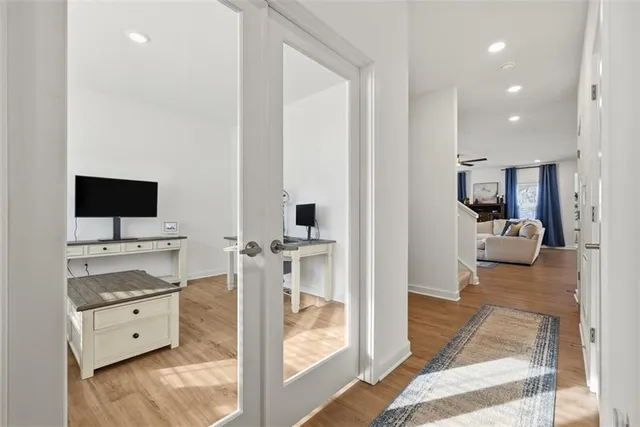 a view of living room kitchen and flat screen tv