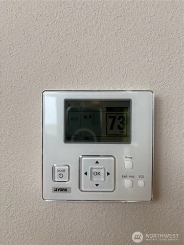 a room with a sink and a mirror