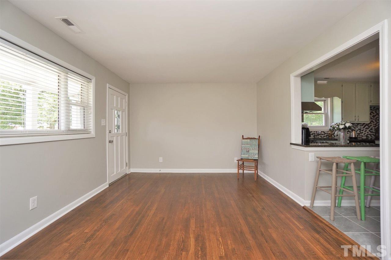 700 Darby Street Raleigh, NC 27610 - Photo 11 of 23 wooden floor in an empty room with a window