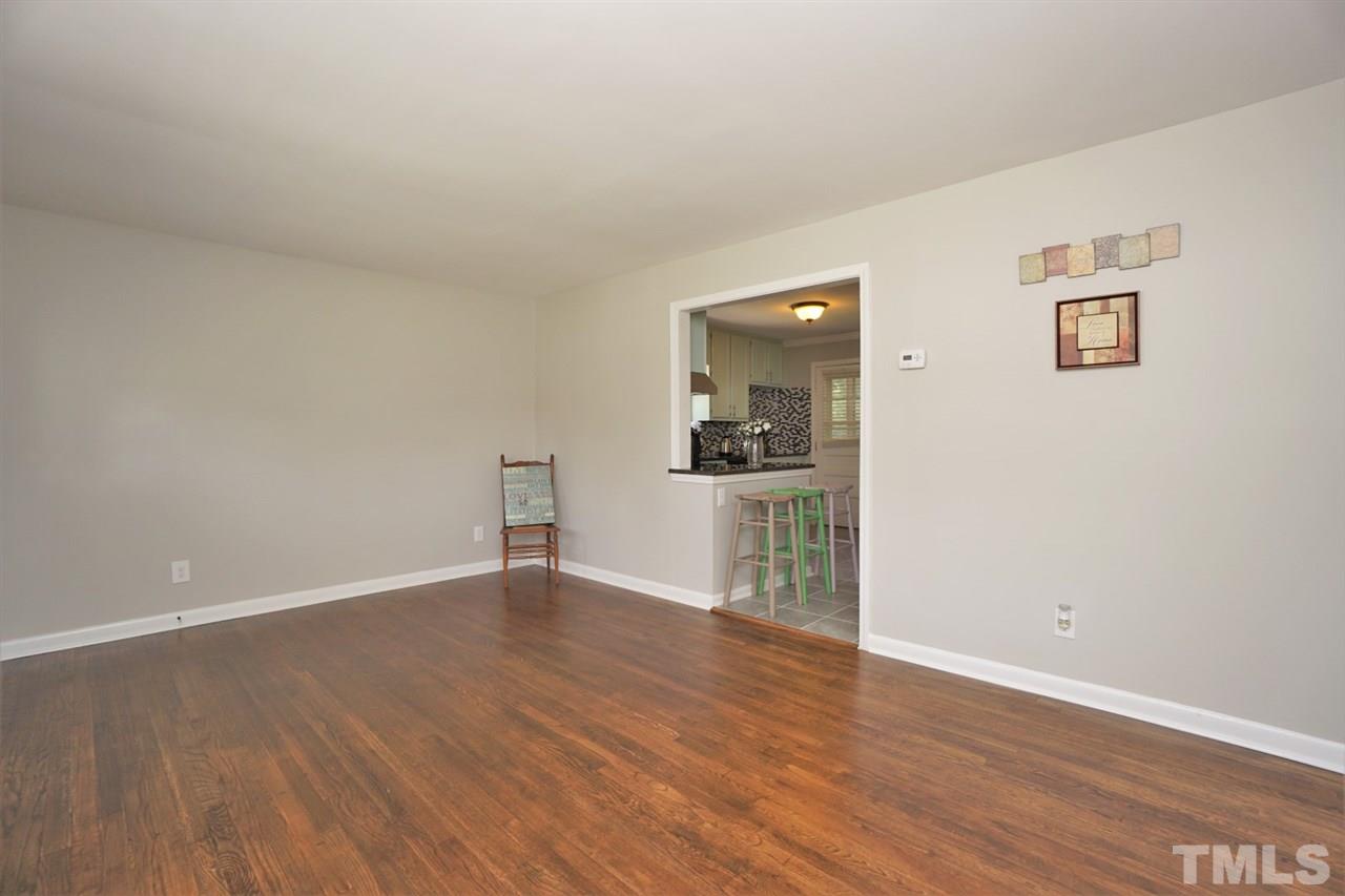 700 Darby Street Raleigh, NC 27610 - Photo 12 of 23 a view of empty room with wooden floor