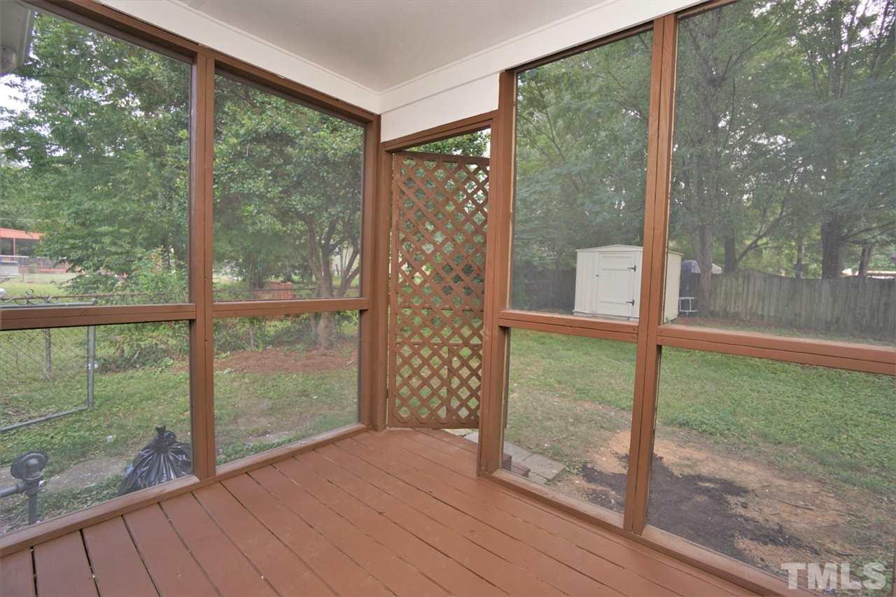 700 Darby Street Raleigh, NC 27610 - Photo 18 of 23 a view of a room with a large window and wooden floor