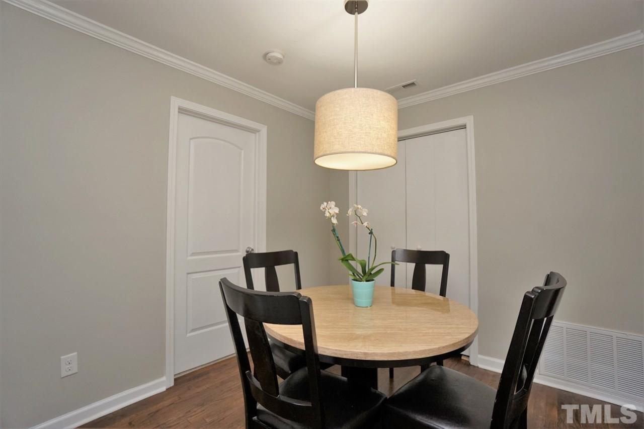 700 Darby Street Raleigh, NC 27610 - Photo 5 of 23 a view of a dining room with a table and chairs