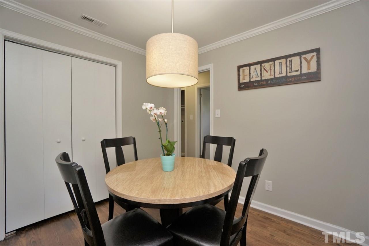 700 Darby Street Raleigh, NC 27610 - Photo 6 of 23 a view of a dining room with furniture and wooden floor