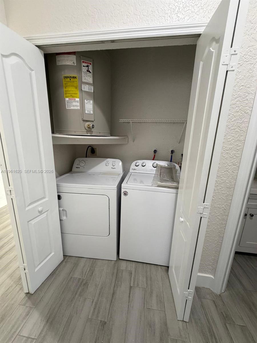 5521 Southwest 158th Court Miami, FL 33185 - Photo 14 of 23 a utility room with dryer and washer
