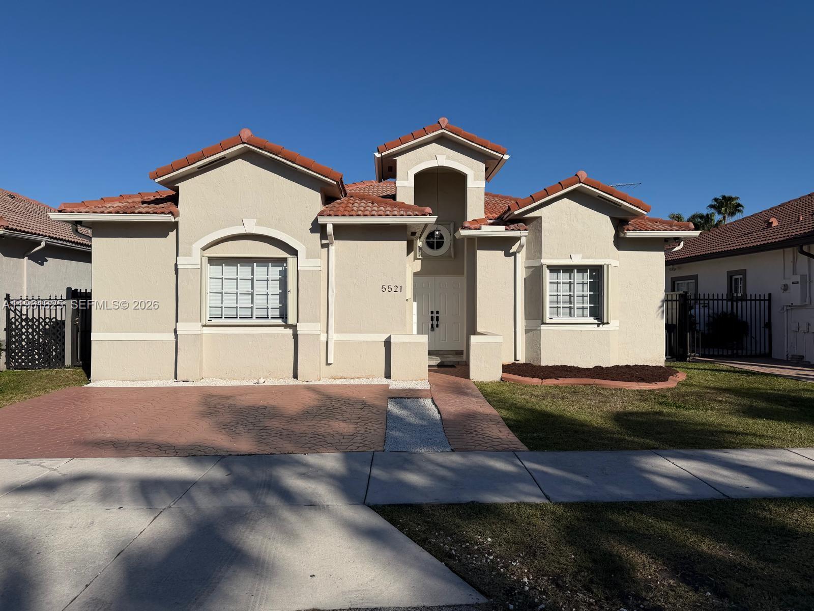5521 Southwest 158th Court Miami, FL 33185 - Photo 2 of 23 a front view of a house with a yard