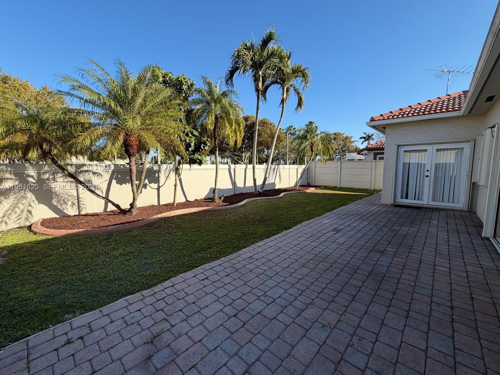 5521 Southwest 158th Court Miami, FL 33185 - Photo 21 of 23 a view of a backyard