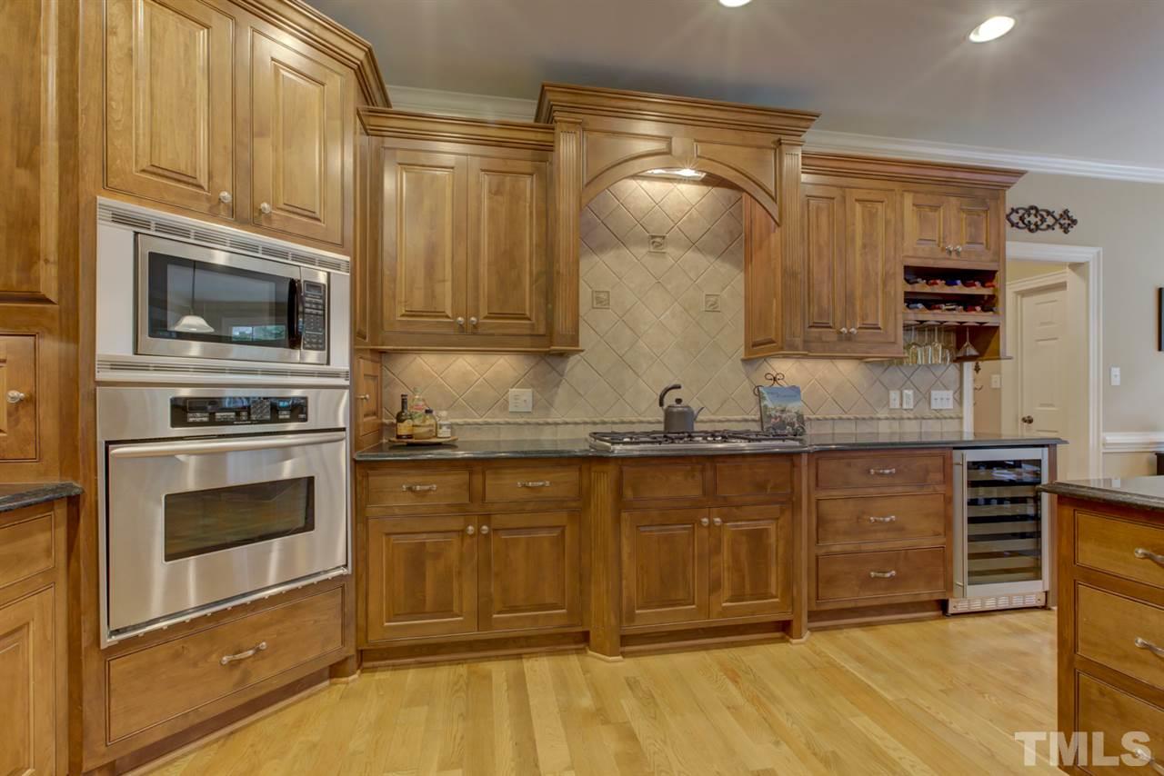 1009 Quiet Ridge Circle Raleigh, NC 27614 - Photo 10 of 30 Kitchen also includes under counter lighting, recessed lights, gas stove and stainless steel appliances. Large Walk In Pantry!