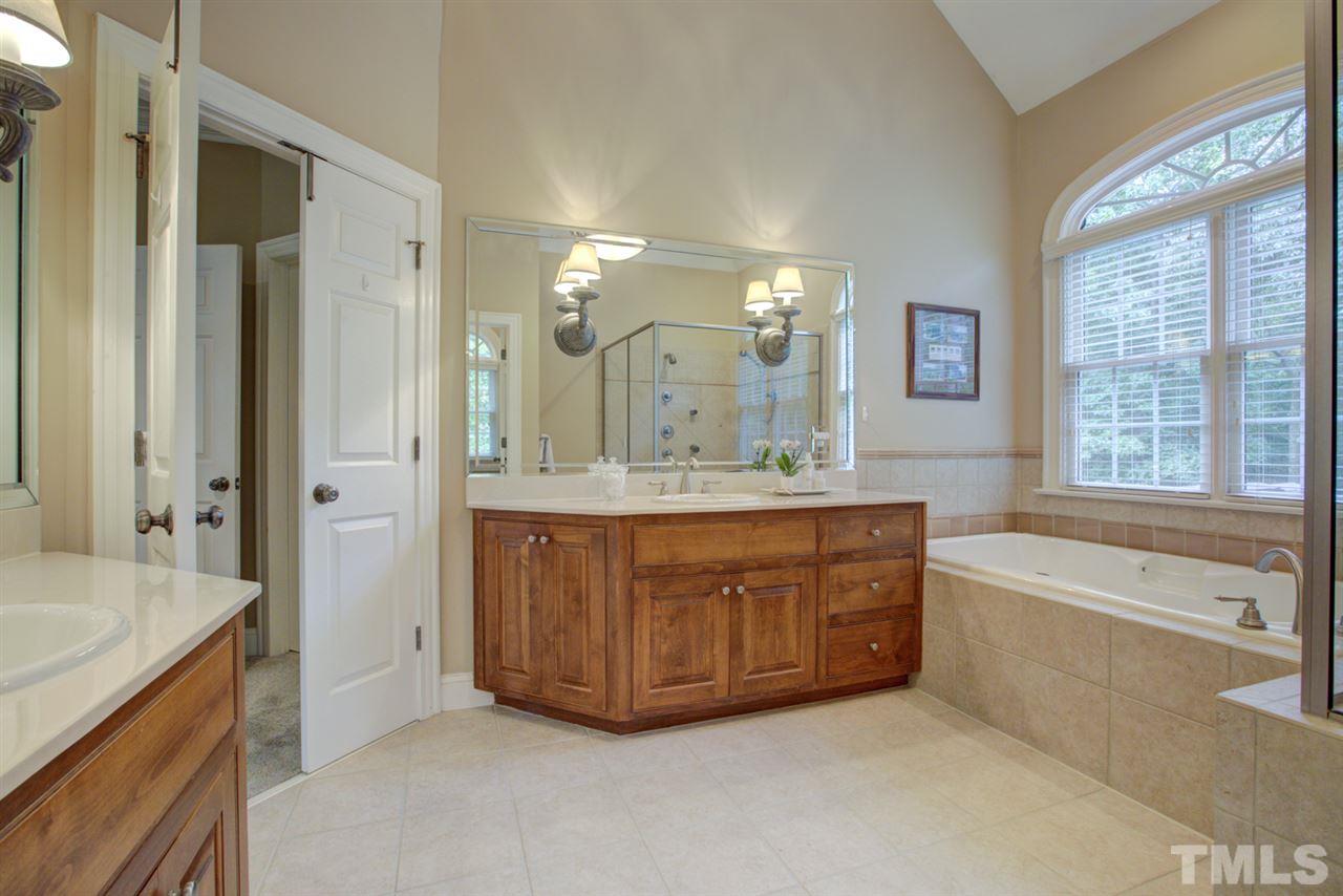 1009 Quiet Ridge Circle Raleigh, NC 27614 - Photo 15 of 30 Luxury Master Bathroom includes His/Hers Vanities and Soaking Tub