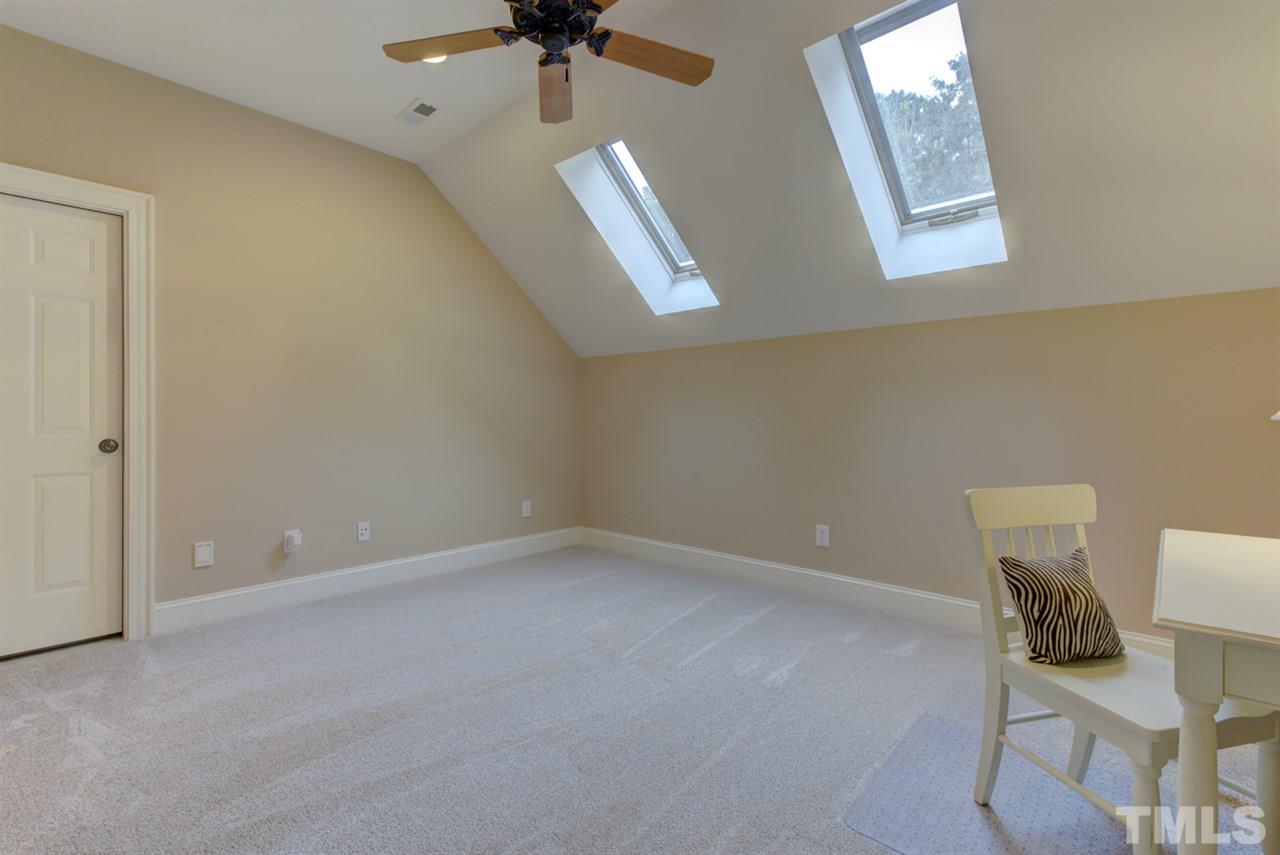 1009 Quiet Ridge Circle Raleigh, NC 27614 - Photo 23 of 30 Finished Third Floor Flexible Space is perfect for office or study area! Adjacent Half Bath. Lots of Storage in Unfinished Walk In attic space