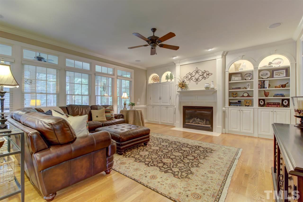 1009 Quiet Ridge Circle Raleigh, NC 27614 - Photo 6 of 30 Wonderful Living Space! Spacious Family Room with Wallk of Windows, Fireplace, Arched Built Ins and Custom Cabinets Surrounding Fireplace