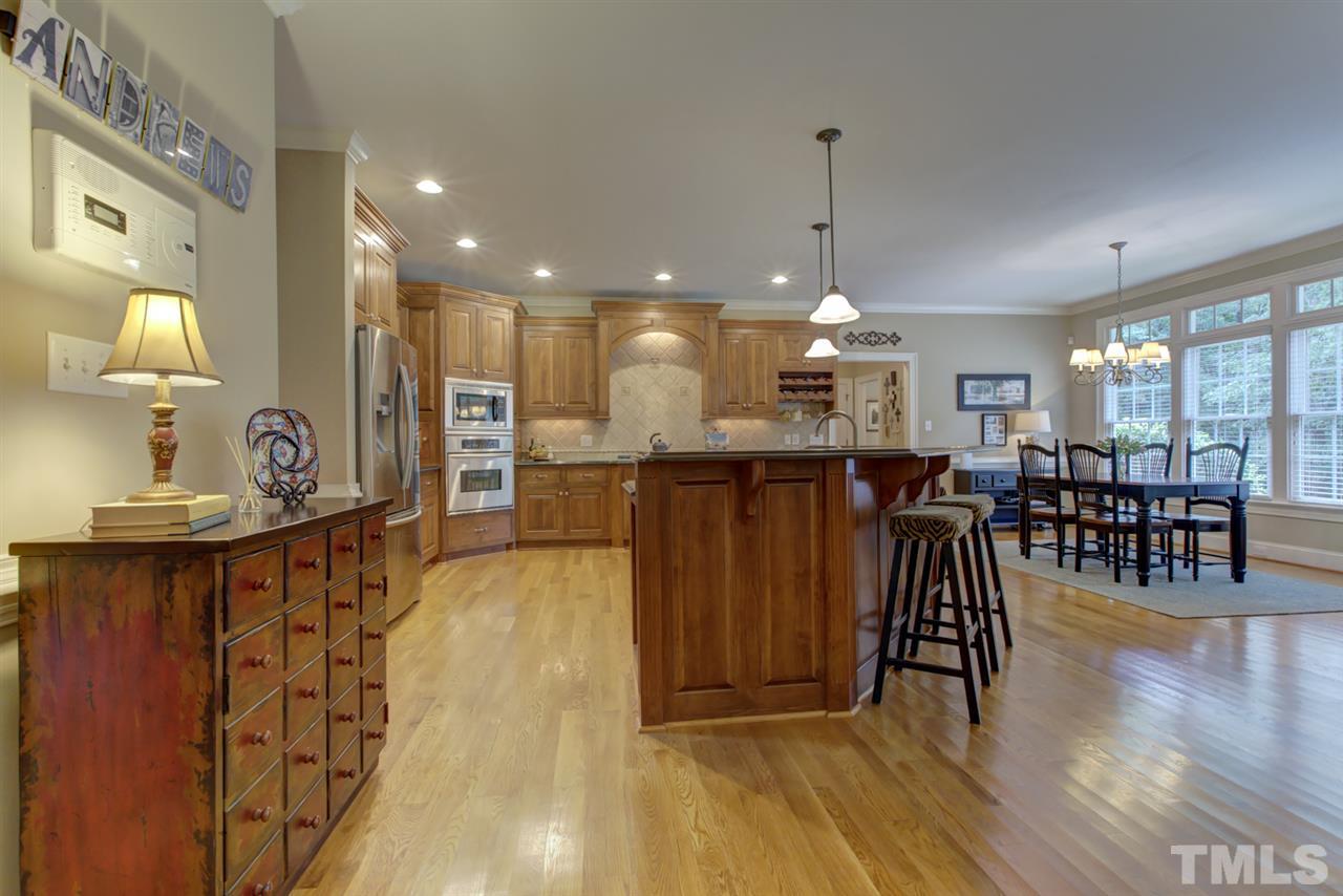 1009 Quiet Ridge Circle Raleigh, NC 27614 - Photo 8 of 30 Huge Gourmet Kitchen and Breakfast Area Flows Directly from Family Room