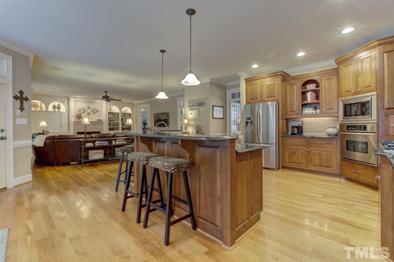 1009 Quiet Ridge Circle Raleigh, NC 27614 - Photo 30 of 30 This view of Gourmet Kitchen shows wonderful open floor plan. Center Island with eat in counter for casual meals