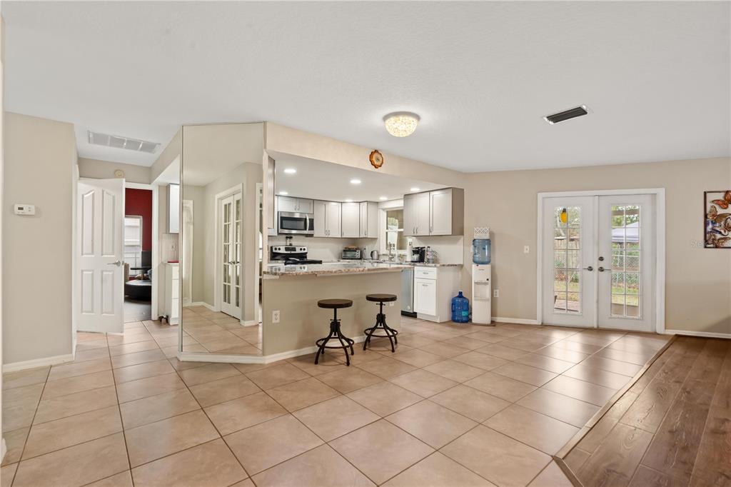 7466 Apache Trail Spring Hill, FL 34606 - Photo 12 of 27 a view of a kitchen with furniture and refrigerator