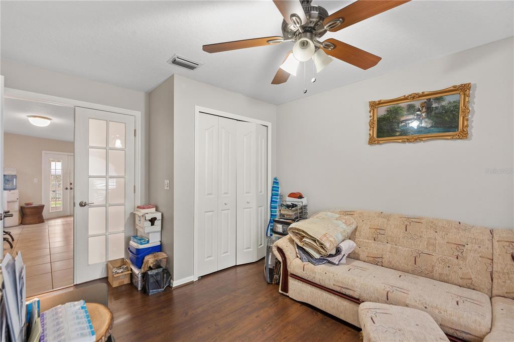 7466 Apache Trail Spring Hill, FL 34606 - Photo 17 of 27 a living room with furniture and wooden floor