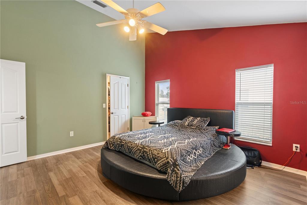 7466 Apache Trail Spring Hill, FL 34606 - Photo 18 of 27 a bedroom with a bed and window