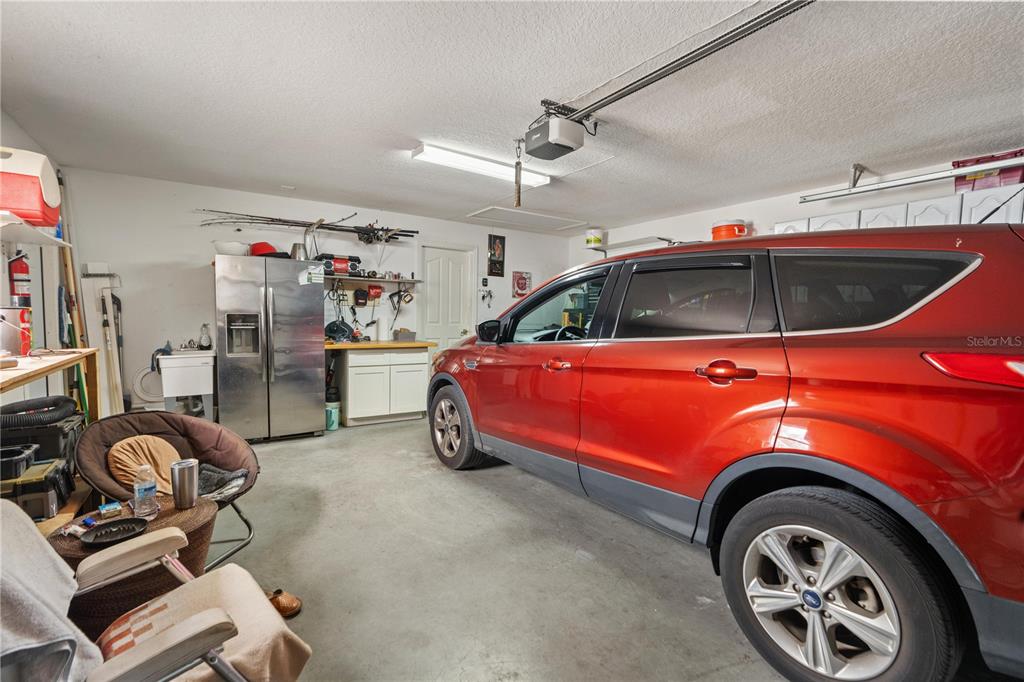 7466 Apache Trail Spring Hill, FL 34606 - Photo 26 of 27 a view of a garage with car parked