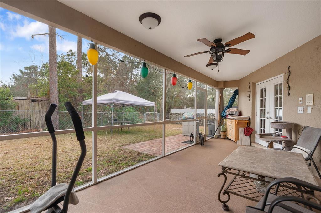 7466 Apache Trail Spring Hill, FL 34606 - Photo 8 of 27 a view of a porch with furniture and a yard
