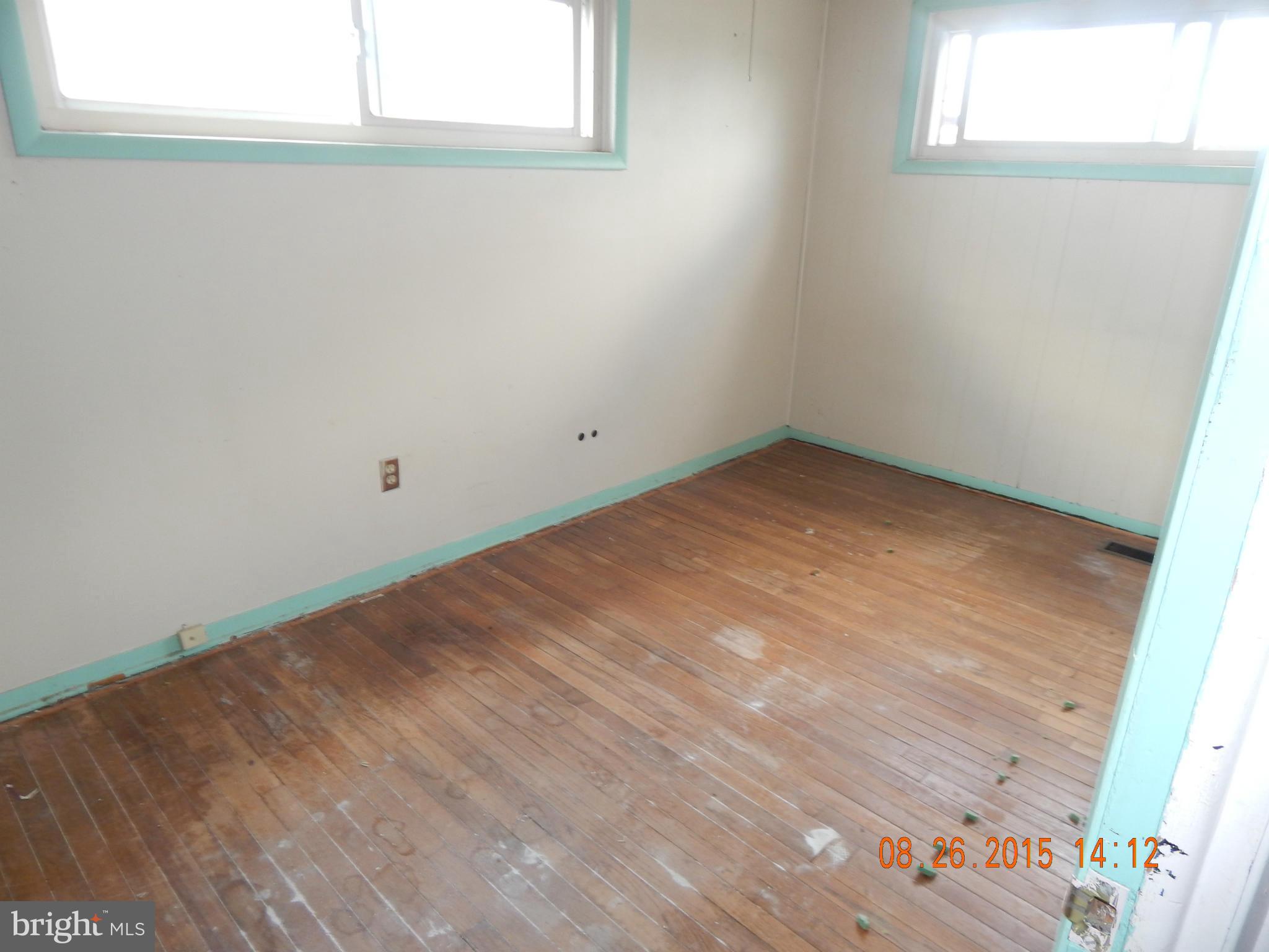 2757 Yarnall Road Baltimore, MD 21227 - Photo 4 of 11 an empty room with a window