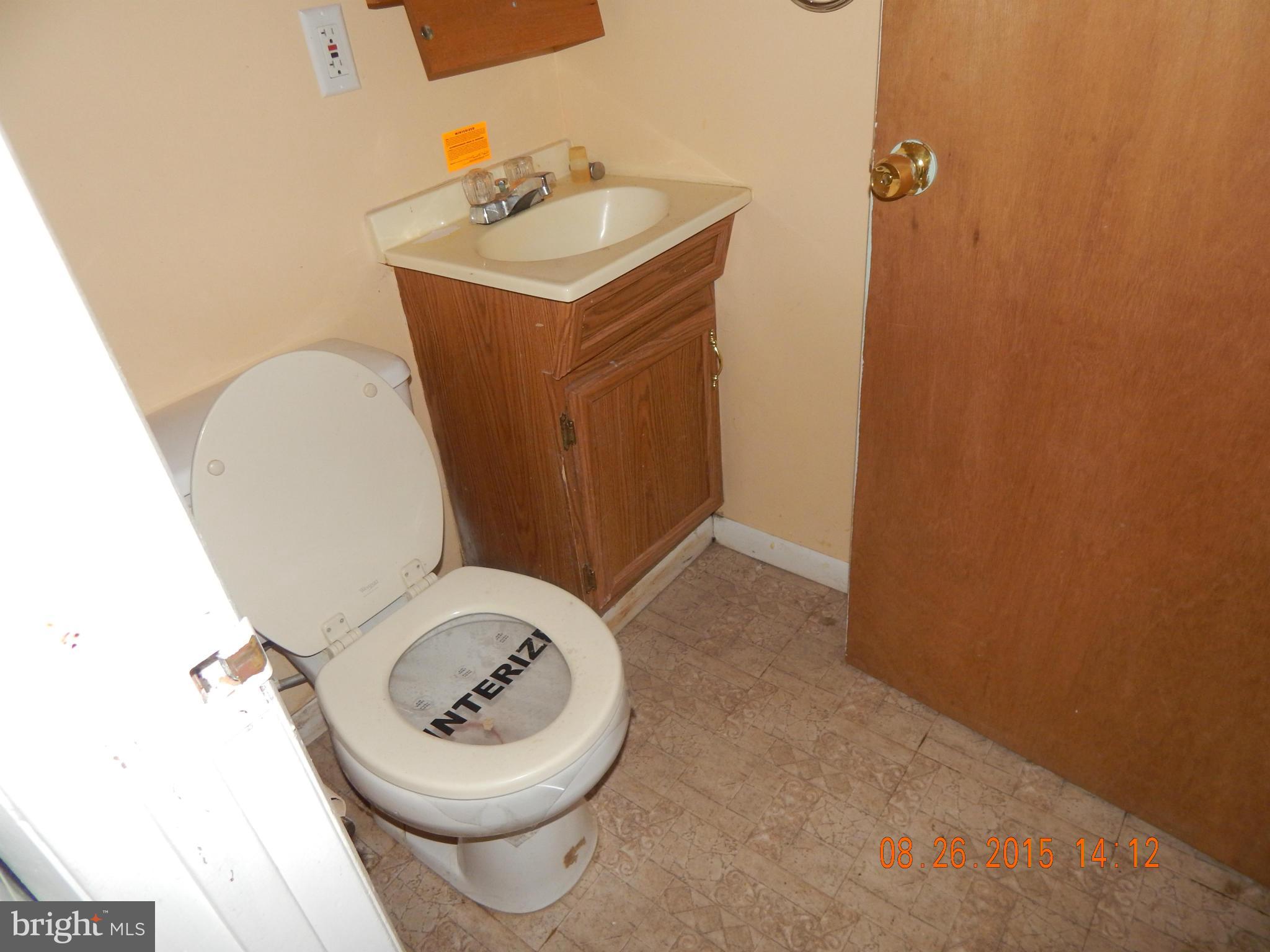 2757 Yarnall Road Baltimore, MD 21227 - Photo 5 of 11 a bathroom with a toilet and a sink