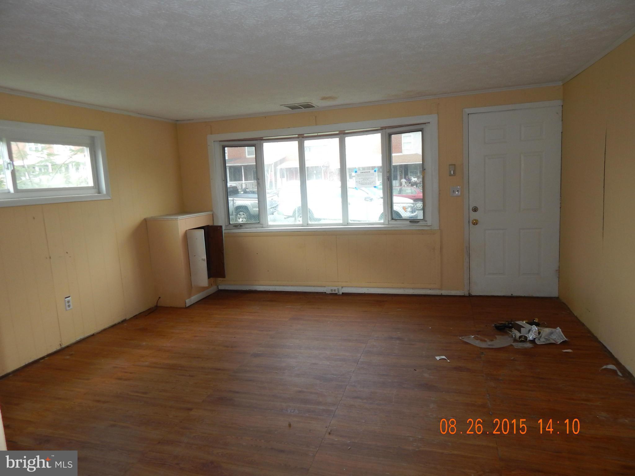 2757 Yarnall Road Baltimore, MD 21227 - Photo 9 of 11 an empty room with wooden floor and windows