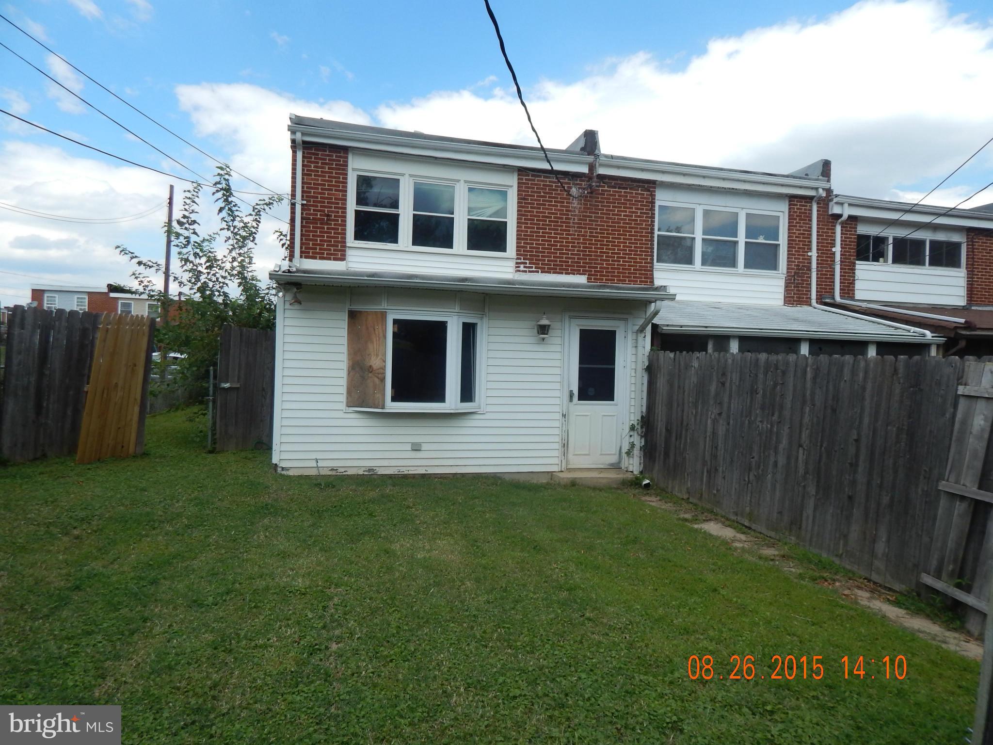 2757 Yarnall Road Baltimore, MD 21227 - Photo 10 of 11 a view of a house with a yard