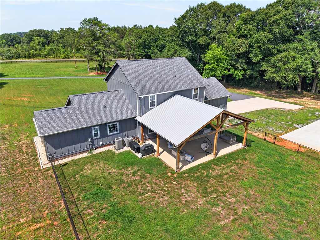 5016 Copeland Road Belton, SC 29627 - Photo 35 of 45 A spacious covered patio invites outdoor relaxation and entertaining.