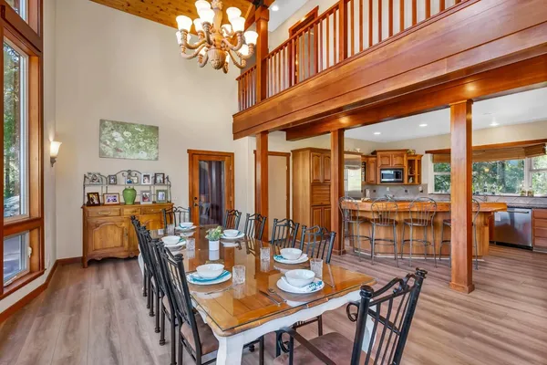 a dining room with furniture and wooden floor