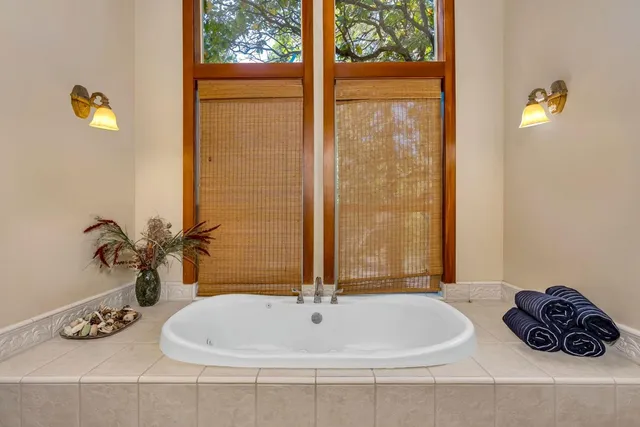 a bathroom with a bathtub and shower