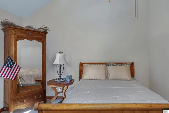 a room with a table and a potted plant