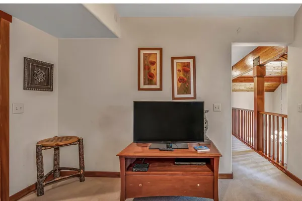 a room with furniture and screen tv