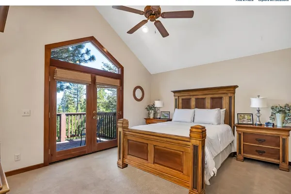 a bedroom with a bed and a night stand
