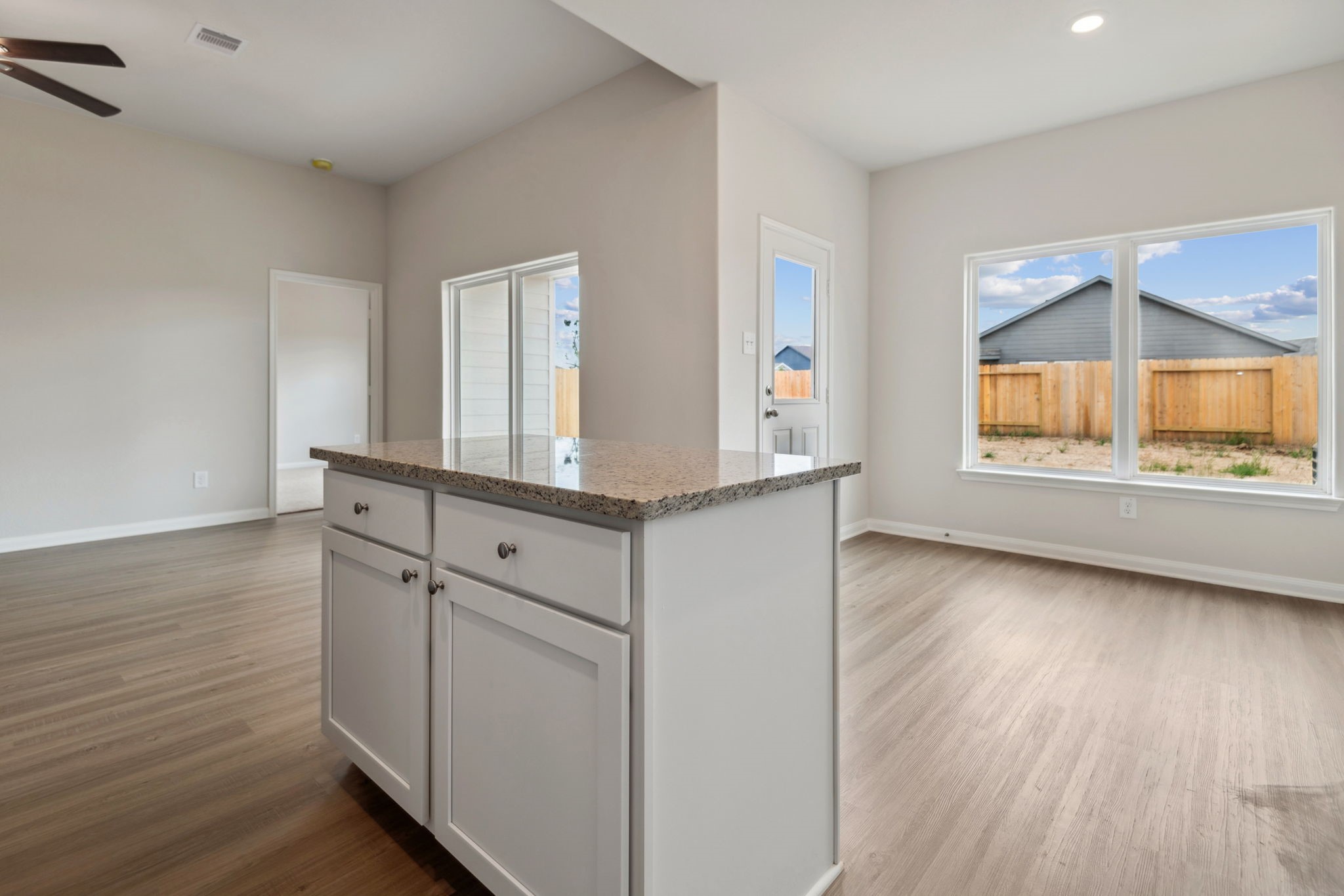 356 Fastboy Lane Waller, TX 77484 - Photo 15 of 23 wooden floor in an empty room with a window and wooden floor